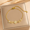 Wholesale Micropaved Zircon Geometric Fourleaf Clover Light Luxury Women's Gold Plated Copper Bracelet