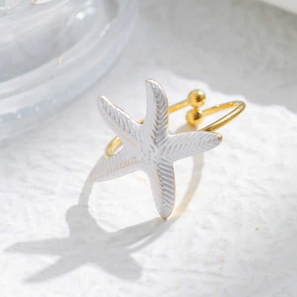 Wholesale Minimalist Fashion Stainless Steel Starfish Round Ring For Women With White Oil Dropping And Electroplating