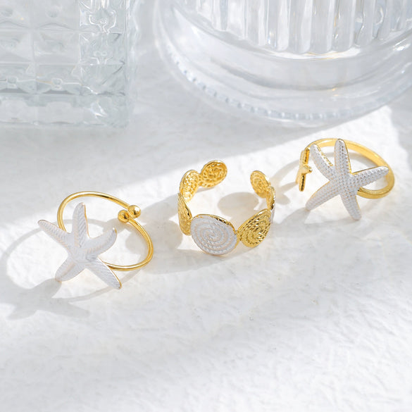 Wholesale Minimalist Fashion Stainless Steel Starfish Round Ring For Women With White Oil Dropping And Electroplating