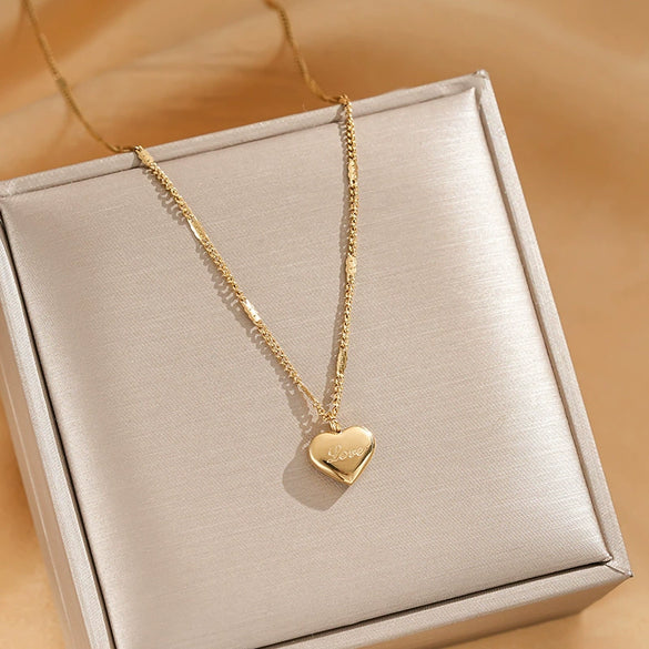 Wholesale Minimalist Heart Shape Titanium Steel Women's Necklace With Cross Chain And Electroplating Treatment