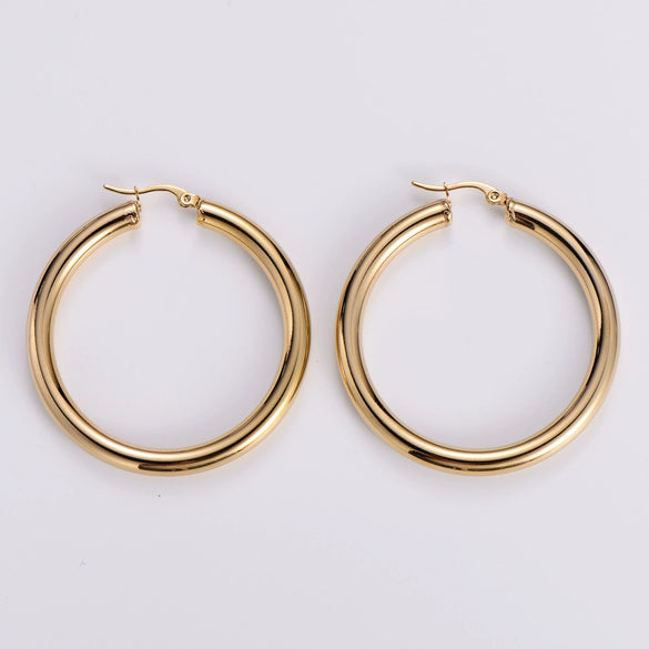 Wholesale Modern Style Exquisite Stainless Steel Polished 18K Gold Plated Thick Round Wire Hollow Large Hoop Earrings With Geometric Design