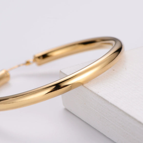 Wholesale Modern Style Exquisite Stainless Steel Polished 18K Gold Plated Thick Round Wire Hollow Large Hoop Earrings With Geometric Design