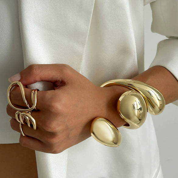 Wholesale Platinum Exaggerated Smooth Hug Water Drop Spring Bracelet For Women With Geometric Style And Electroplating Treatment