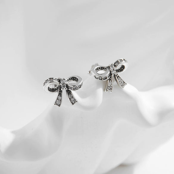 Wholesale Silver Sweet Cool Style Bow Shiny Diamond Earrings For Women With Old Craft