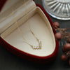 Wholesale 225 Silver Vshaped Women's Light Luxury Necklace With Small Skirt Pendant Inlaid With Square Zircon And Plated With 14K Gold And Chain With Letters Numbers Text Pattern