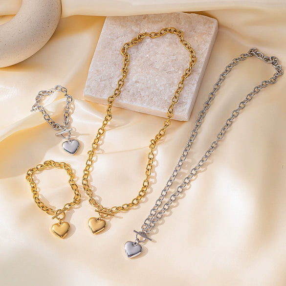 Wholesale Simple And Popular Ot Buckle Glossy Titanium Steel Heart Pendant Necklace With Love Water Drops Bells Pattern Electroplated For Women