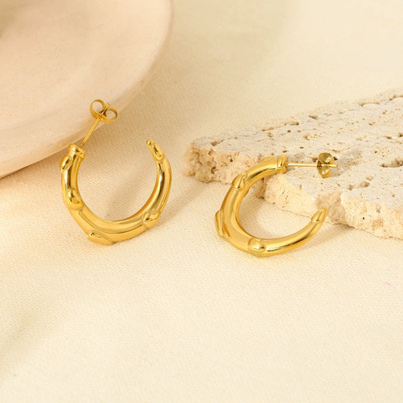 Wholesale Simple Modern Style Heartshaped Embossed Cshaped Stainless Steel Electroplated 18K Nonfading Gold Earrings For Women