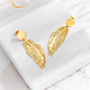 Wholesale Simple Retro Cold Style Titanium Steel Long Exaggerated Feather Pendant Earrings With Geometric Pattern And Electroplating Treatment