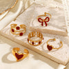 Wholesale Simple Style Stainless Steel Red Oil Dropping Love And Bow Ring With Electroplating Geometric And Heart Shape For Ladies And Unisex