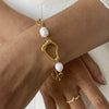 Wholesale Stainless Steel And Titanium Steel Pearl Necklace With Wave Pattern And Electroplating For Women