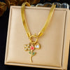 Wholesale Stainless Steel Fashion Retro Snake Bone Chain Oil Dropping Rose Pendant Necklace With Gold Plated And Flower Pattern