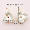 Wholesale Stainless Steel French Retro Flower Earrings With Imitation Shell And Electroplating Treatment