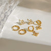 Wholesale Stainless Steel Geometric Electroplating Women's Zircon Four Awn Star And Cross Earrings