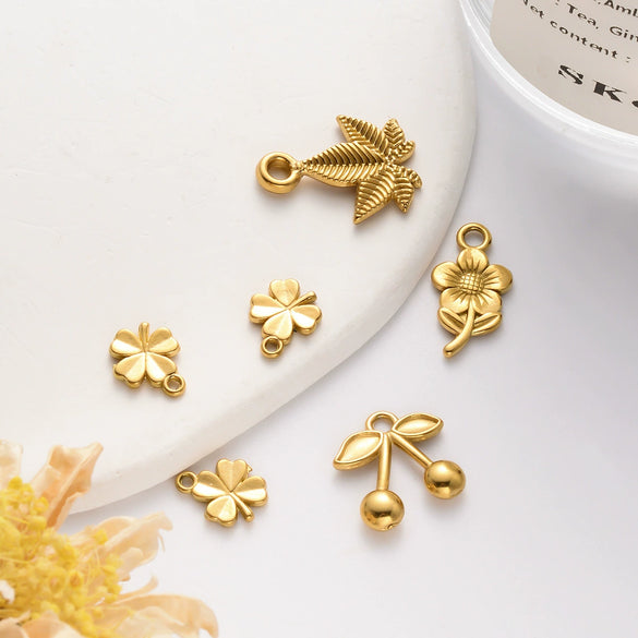 Wholesale Stainless Steel Jewelry Pendant With Sunflower Cherry Maple Leaf Lucky Grass Shapes And Electroplating Treatment