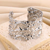 Wholesale Stainless Steel Open Bracelet With Geometric Concave And Convex Pattern And Electroplating Design