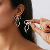 Wholesale Stud Earrings Zinc Alloy Geometric Irregular Fold Corrugated Smooth Petal Bow Style With Stainless Steel Ear Needles And Electroplating