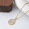 Wholesale Titanium Steel And Copper Ginkgo Biloba And Oval Inlaid Pearl Pendant Necklace For Women With Electroplating Design