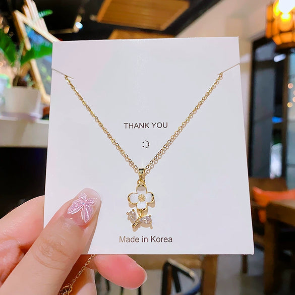 Wholesale Titanium Steel And Copper Women's Minimalist Geometric And Small Flower Pendant Necklace With Electroplating And Cross Chain