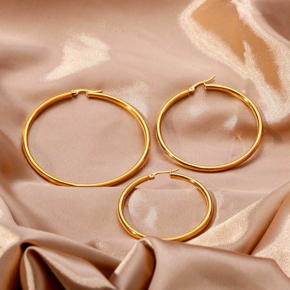 Wholesale Titanium Steel And Stainless Steel Hollow Crescent Earrings With 18K Gold Electroplating