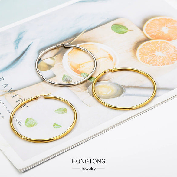 Wholesale Titanium Steel And Stainless Steel Hollow Crescent Earrings With 18K Gold Electroplating