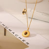 Wholesale Titanium Steel And Tiger Eye Stone Inlaid Sunflower Pendant Necklace For Women With Vacuum Plating