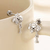 Wholesale Titanium Steel Animals Puppy Bone Style Women's Ear Nails With Electroplating