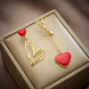 Wholesale Titanium Steel Asymmetric Hollow Heart Shape Hanging Earrings For Women With Electroplating Treatment