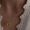 Wholesale Titanium Steel Bow Pendant Necklace For Women With 18K Gold Plating
