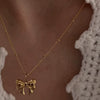 Wholesale Titanium Steel Bow Pendant Necklace For Women With 18K Gold Plating