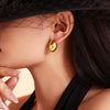 Wholesale Titanium Steel Geometric Goose Egg Shaped Earrings With Electroplating And Retro Temperament