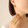 Wholesale Titanium Steel Goldplated Geometric Cshaped Earrings With Inlaid Imitation Pearl Zircon