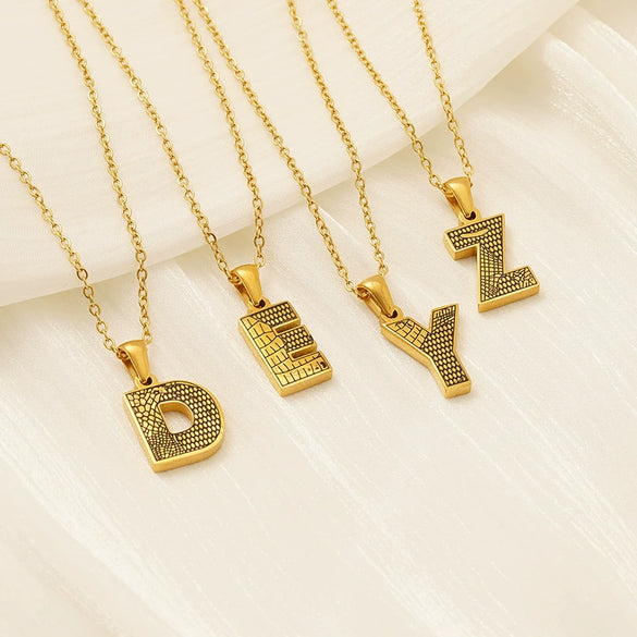 Wholesale Titanium Steel Goldplated Jewelry With Bark Pattern And English Letter Pendant Necklace Fashion Style Unisex