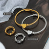 Wholesale Titanium Steel Goldplated Love Shape Jewelry Set Including Adjustable Coil Bracelet And Trendy Ring