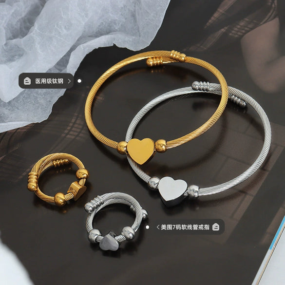 Wholesale Titanium Steel Goldplated Love Shape Jewelry Set Including Adjustable Coil Bracelet And Trendy Ring