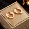 Wholesale Titanium Steel Hollow Heart Earrings With Electroplating For Women
