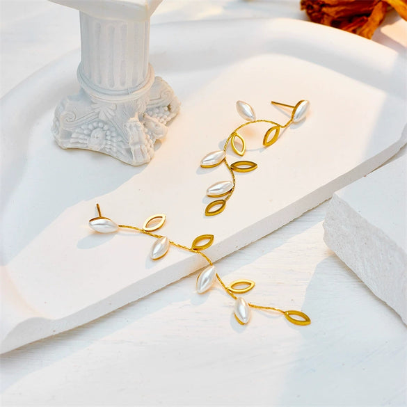 Wholesale Titanium Steel Pearl Hollow Leaf Long Hanging Earrings For Women With Electroplating Design