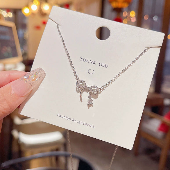 Wholesale Titanium Steel Zircon Inlaid Bow Pendant Necklace For Women