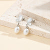 Wholesale Unique Motherofpearl Pearl Butterfly Earrings For Women Electroplated Stainless Steel Geometric Design