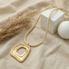 Wholesale Unisex Casual Geometric Alloy Electroplated Hollow Irregular Square Pendant Necklace With Rope Chain