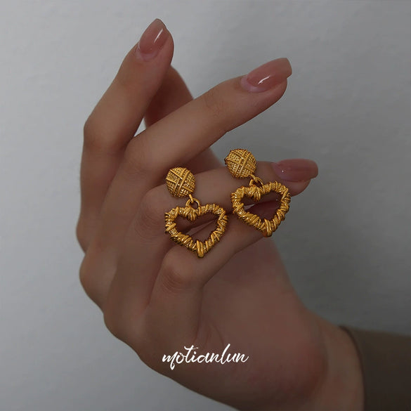 Wholesale Unisex Geometric Hollow Love Design Goldplated Titanium Steel Stud Earrings