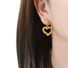 Wholesale Unisex Geometric Hollow Love Design Goldplated Titanium Steel Stud Earrings
