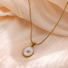 Wholesale Unisex Gold Electroplated Stainless Steel Scallop Inlaid Oval Cross Chain Necklace With White Enamel