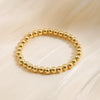 Wholesale Unisex Retro Simple Alloy Round Bead Elastic Bracelet With Electrophoresis Gold Treatment