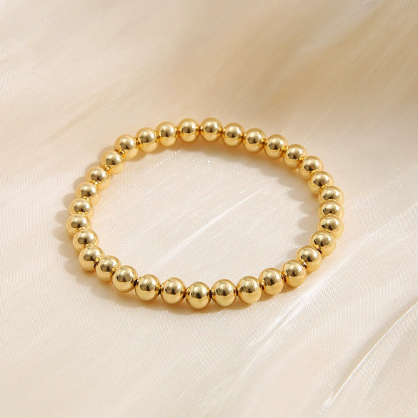 Wholesale Unisex Retro Simple Alloy Round Bead Elastic Bracelet With Electrophoresis Gold Treatment