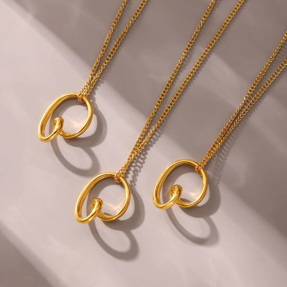 Wholesale Unisex Simple Geometric Ferris Wheel Asymmetrical Heart Pendant Necklace Made Of Titanium Steel With Electroplating Design