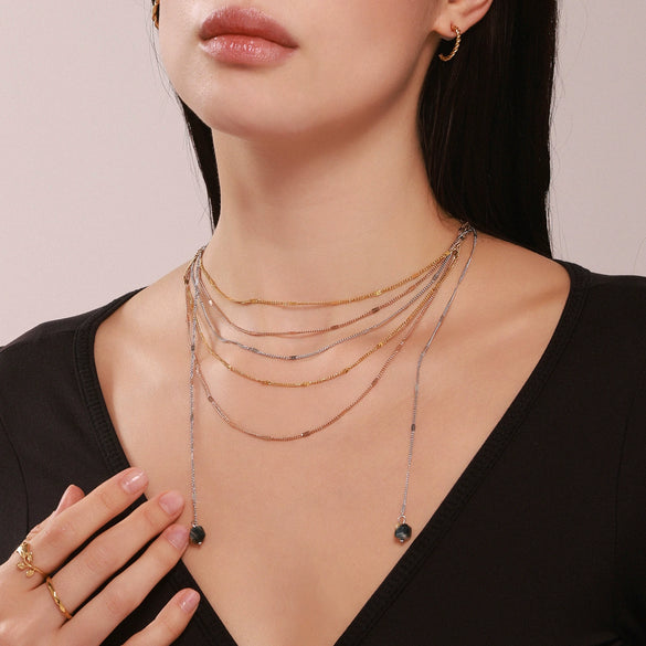 Wholesale Unisex Simple Geometric Ferris Wheel Cutout Volcanic Stone Tassel Titanium Steel Electroplated Necklace