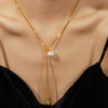 Wholesale Unisex Simple Geometric Titanium Steel Electroplated Necklace With Snake Chain And Round Bead Tassel Pendant