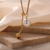 Wholesale Unisex Simple Geometric Titanium Steel Electroplated Necklace With Snake Chain And Round Bead Tassel Pendant