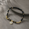 Wholesale Unisex Titanium Steel Black Beaded Bracelet With 14K Goldplated Electroplated Design