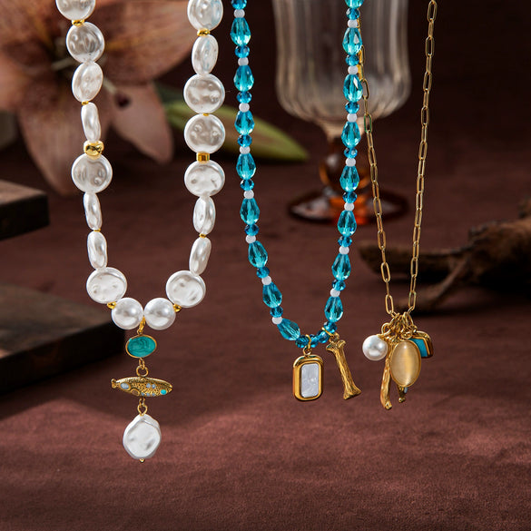 Wholesale Unisex Titanium Steel Zircon Small Fish Pearl Pendant Necklace And Earrings In Baroque And Minimalist Style